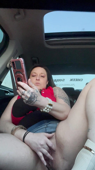 Horny Slut Watching Porn Using Dildo in Car While Driving Down the Road