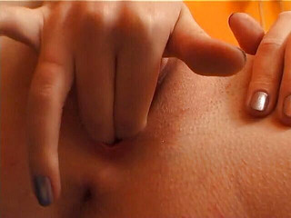 Blonde chick with small tits fingers and toys her pussy