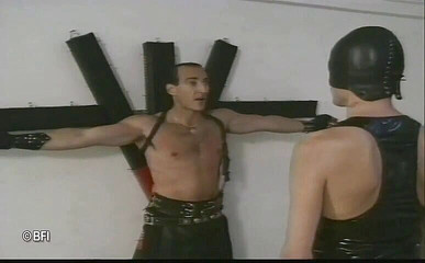 Bound girl in leather outfit whipped