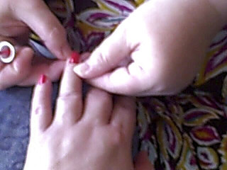 Apply hand lotion and red nail polish for you