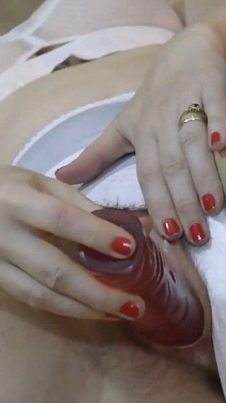 Dressed in classic style of the 50's of the XXth century, including genuine seamed stockings, nylon panties and bullet bra