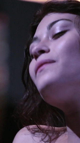 Busty babe rubs her hairy snatch