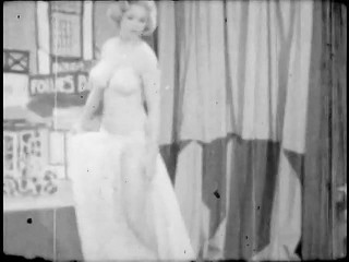 Strip-tease of a blonde woman in the sixties