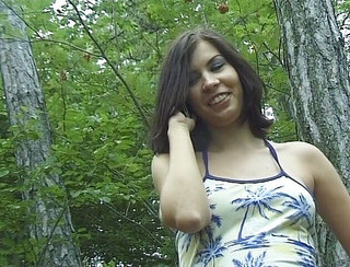 Awesome brunette in woods posing for the camera