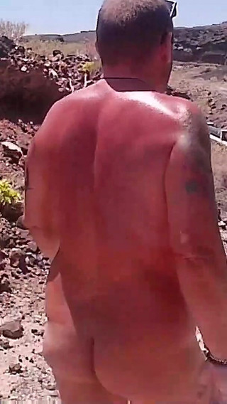 Couple Is Hiking Naked Near the Coast