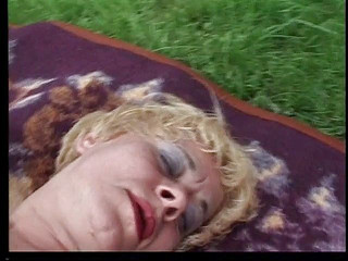 Sexy older blonde babe masturbates outside