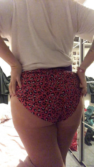 Strip tease showing off big boobs and ass