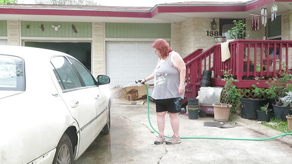 Sexy Mature bbw redhead Nurse Vicki washes her car!