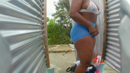 Prying Camera in Beach Booth Reveals Latina with Sensual Hips