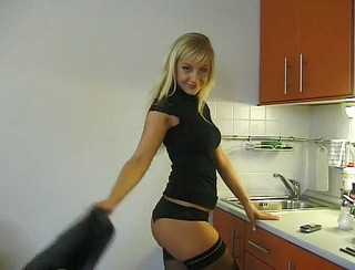 Stockinged blonde beauty rubs her snatch