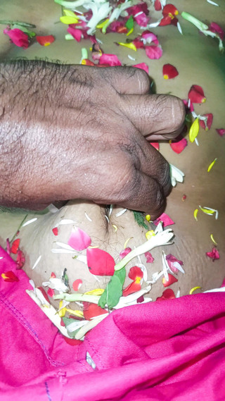 Married Couple Enjoying Romance in Flower Bed