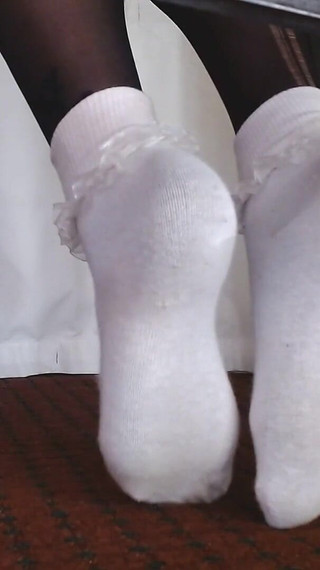 Ruffled Socks Over Black Pantyhose