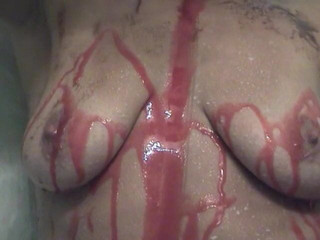 Stunning russian babe shows off her sexy round ass pouring chocolate syrup on it