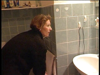 Woman pissing in the bathroom