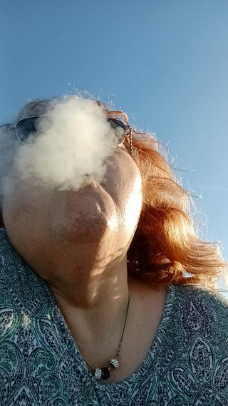 Bearded Lady try's to lights on windy beach!