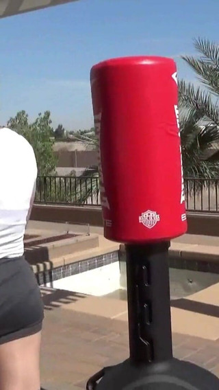 Smoking outdoor with the boxing muscled lady