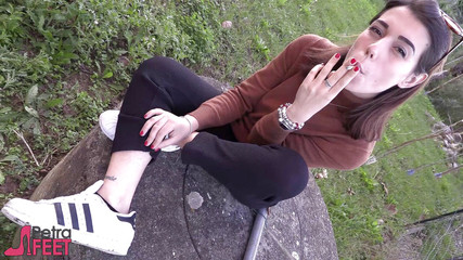 Beauty teen in outdoor smoking