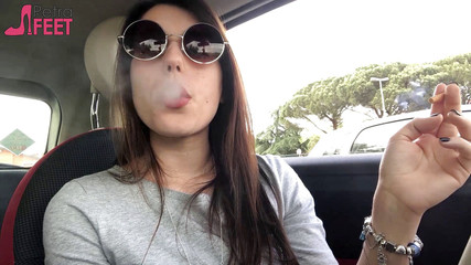 Petra smoking in car
